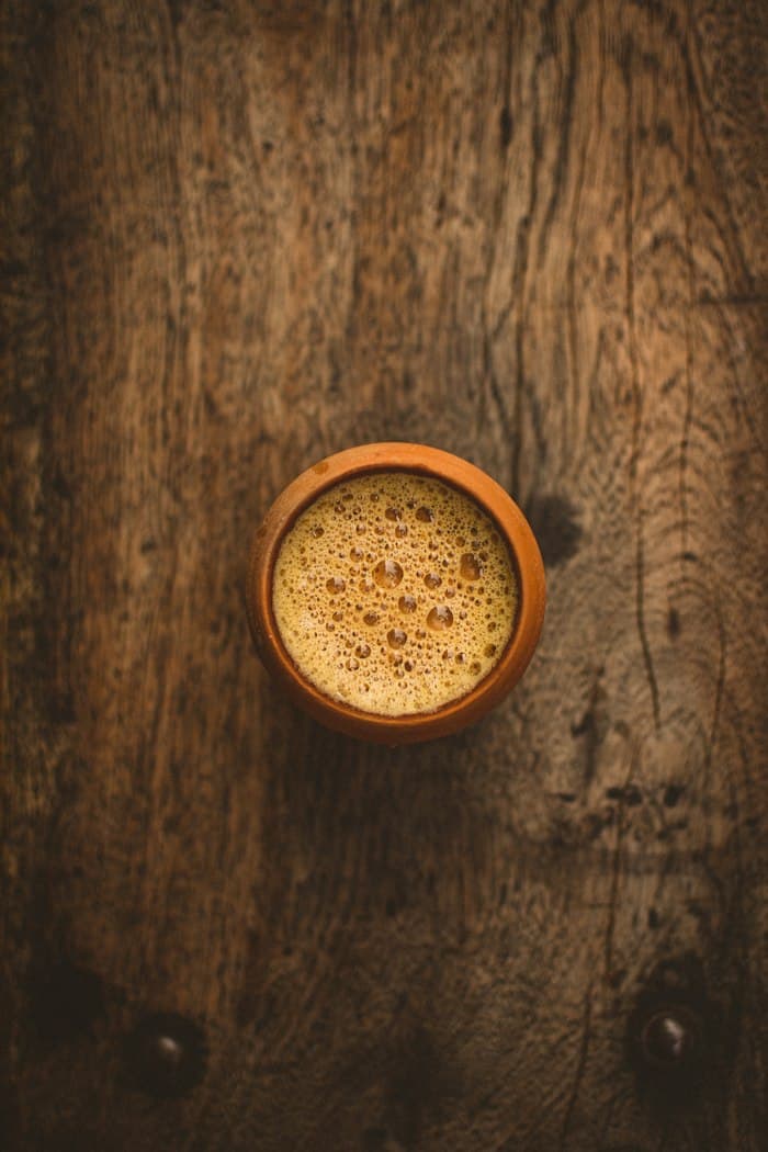 Frothy chai in a kulhad, from above