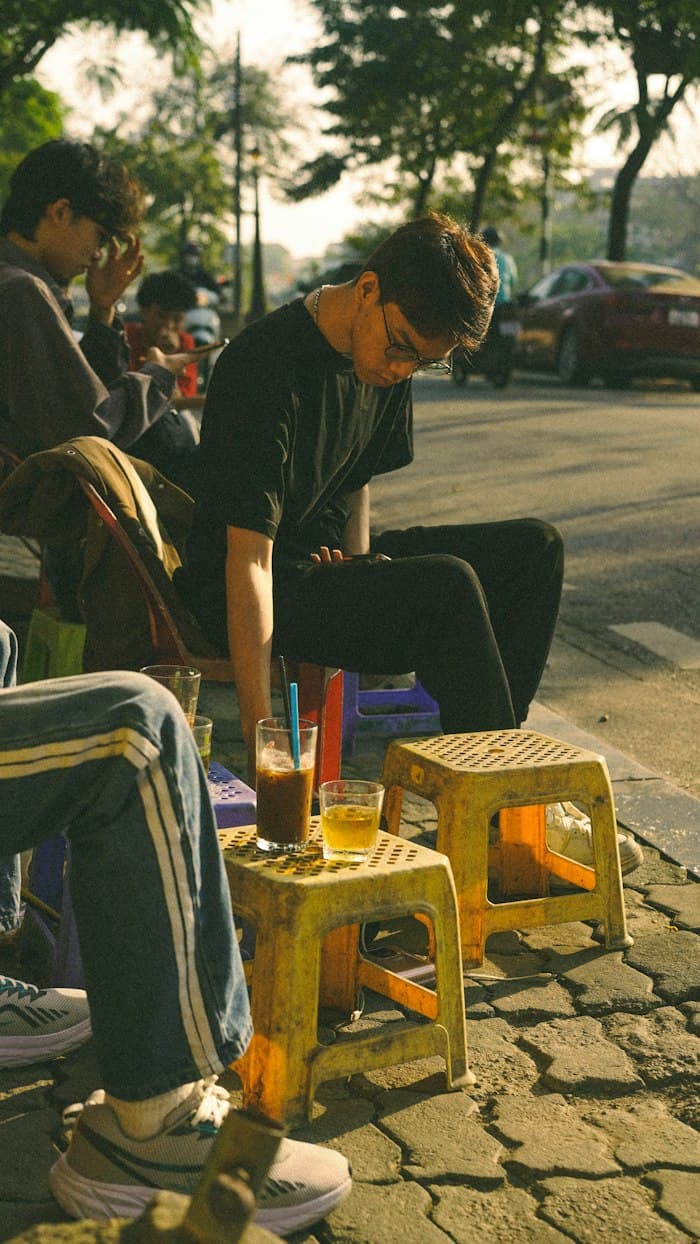 Friends with chai at a street-side stall